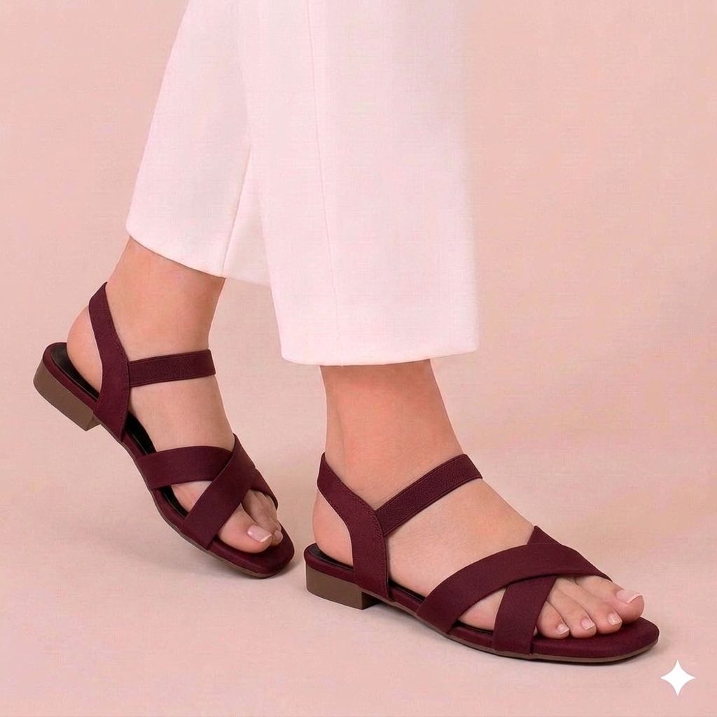 Neutral tan mustard women's sandals with a minimalist criss-cross design for daily wear.