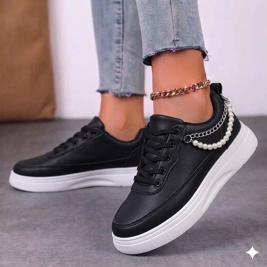 Women's retro black and white panda sneakers with a classic low-top profile.