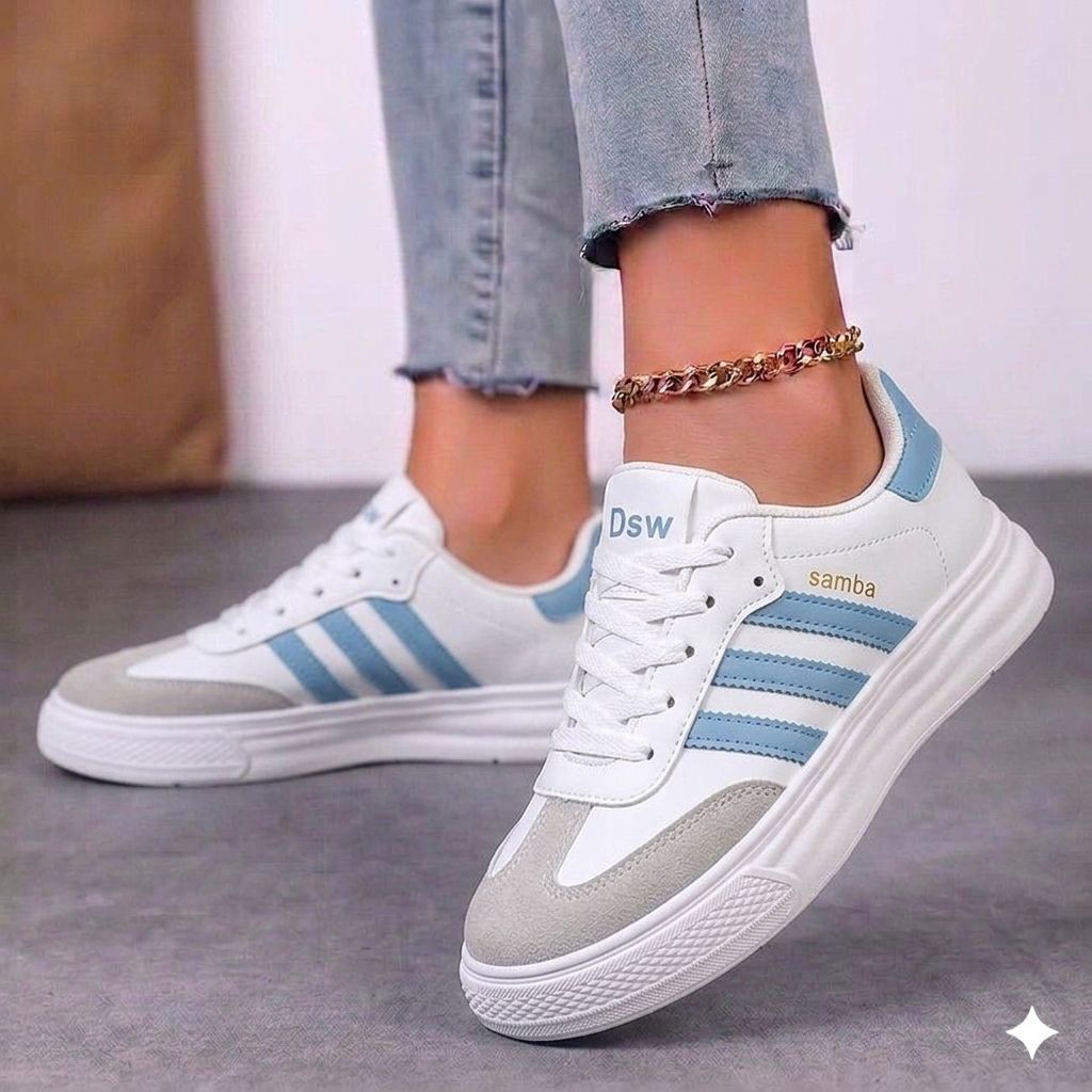 Front angle of black and white high-top streetwear sneakers showing the clean white toe box and black laces.