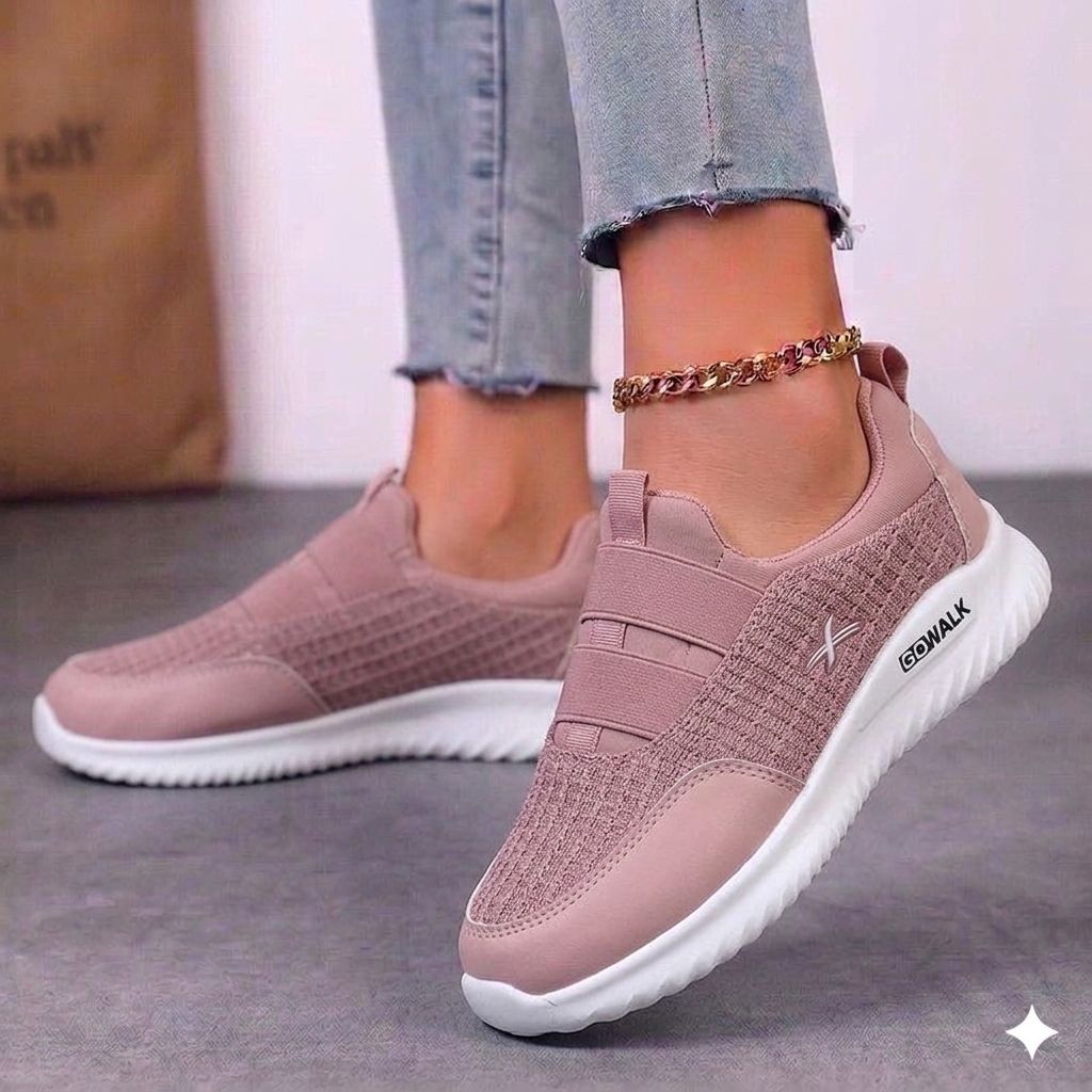 Women's white sneakers with vibrant pink and yellow floral embroidery on the outer side.