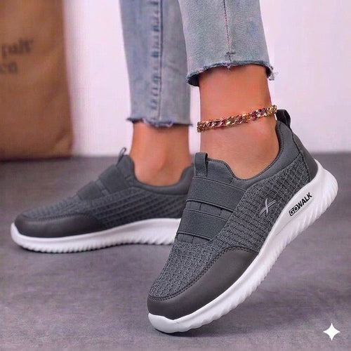 Close-up of the high-quality stitching and floral detail on the heel of the embroidered sneaker.