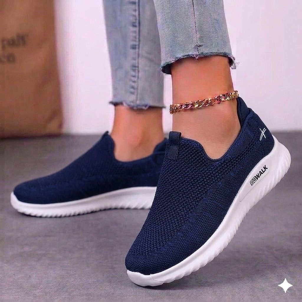 Close-up of the durable stitching and vulcanized sole on black and white urban trainers.