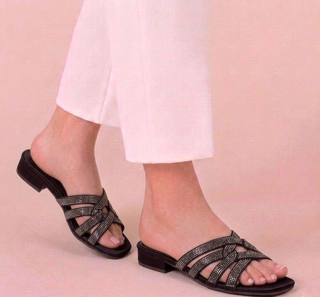Black elegant low heel sandals with rhinestone straps for women.