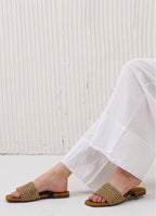 Close-up of premium crystal heart detail on transparent wedding guest flats.