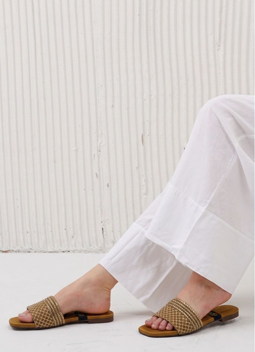Close-up of premium crystal heart detail on transparent wedding guest flats.
