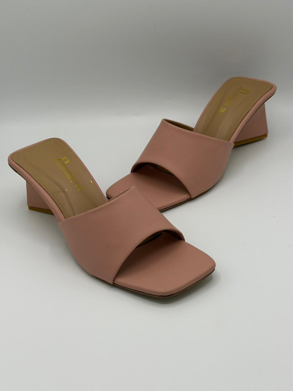 Pair of brown open-toe sandals on a light gray background
