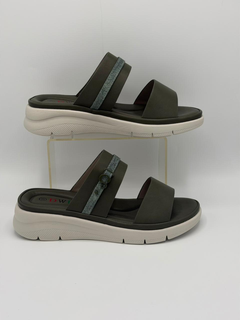 Pair of brown sandals with white soles on a white background