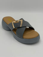 Gray sandal with brown insole on a gray background