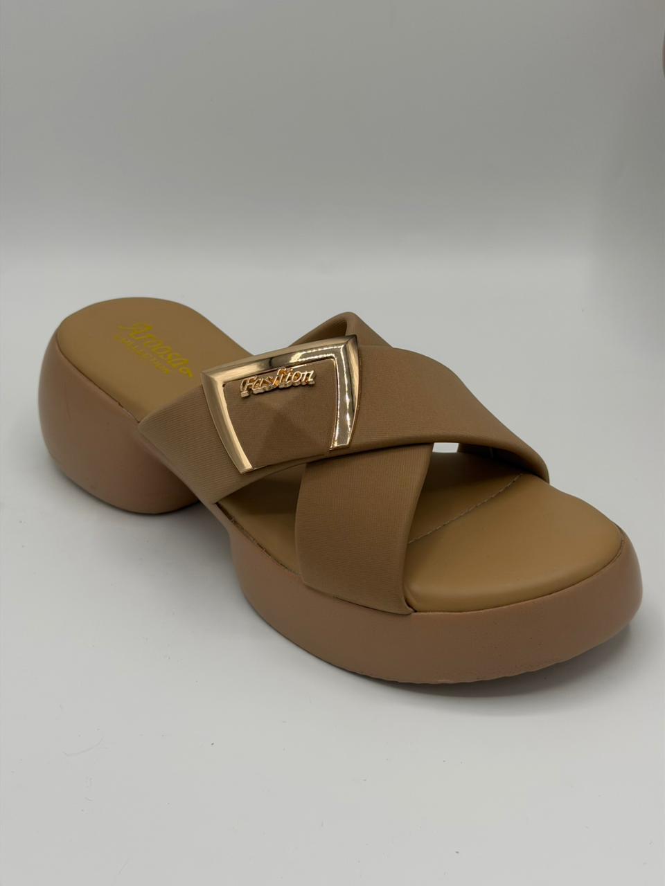 Brown sandal with a gold buckle on a white background