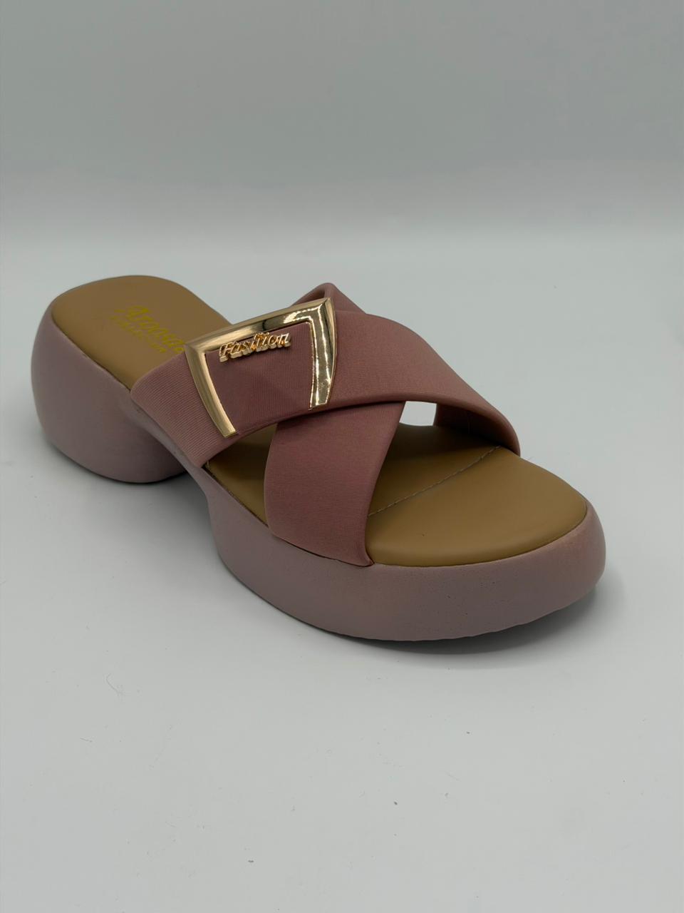 Brown sandal with a gold buckle on a white background