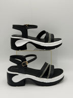 Soft Dusty Rose chunky platform sandals with adjustable buckle and wave-patterned sole.