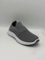 A gray slip-on sneaker with a textured knit upper, a white midsole, and a dark gray outsole, shown on a light gray background.
