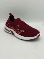 A maroon slip-on mesh sneaker with a white sole and a pink and white embroidered lotus flower on the side, shown against a plain light gray background.