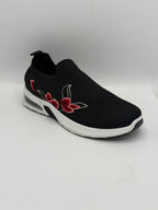 A black slip-on mesh sneaker with a white sole and red floral embroidery on the side, shown against a plain white background.