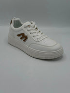 A white low-top sneaker with a brown stylized 'M' logo on the side, white laces, and a thick white platform sole, shown against a neutral gray background.