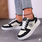 Side view of women's pastel platform sneakers with floral and star patchwork design.