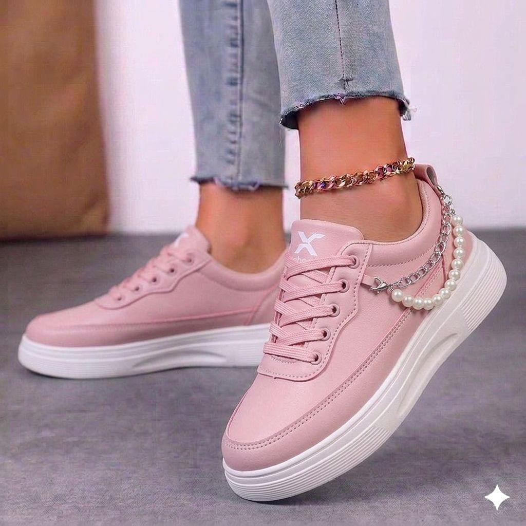 Close-up of the flat white rubber sole and high-quality black stitching on urban sneakers.