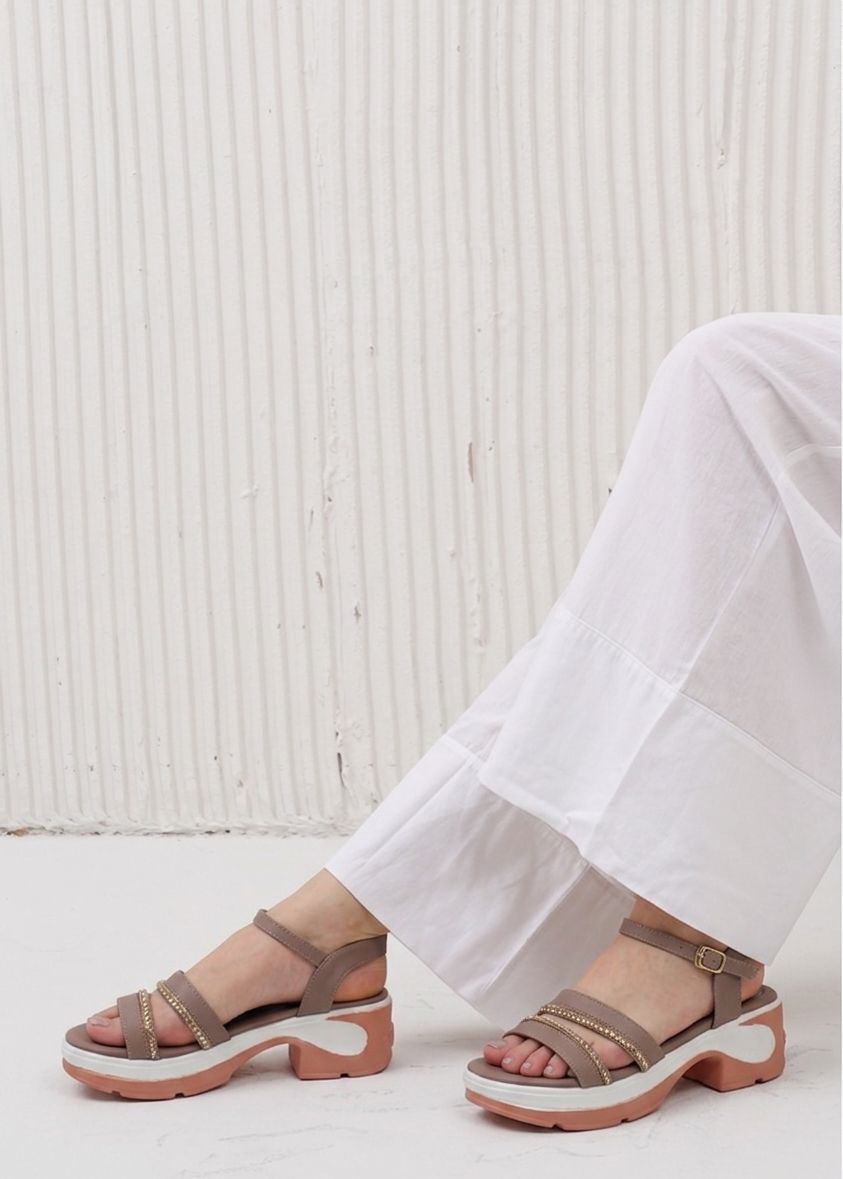 Side profile of Rich Camel wedge sandals with metallic chain detailing on the straps.