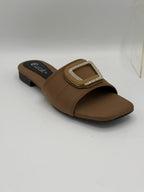Brown sandal with a decorative buckle on a white background