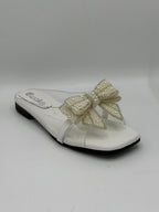 White sandal with a large pearl bow on a white background