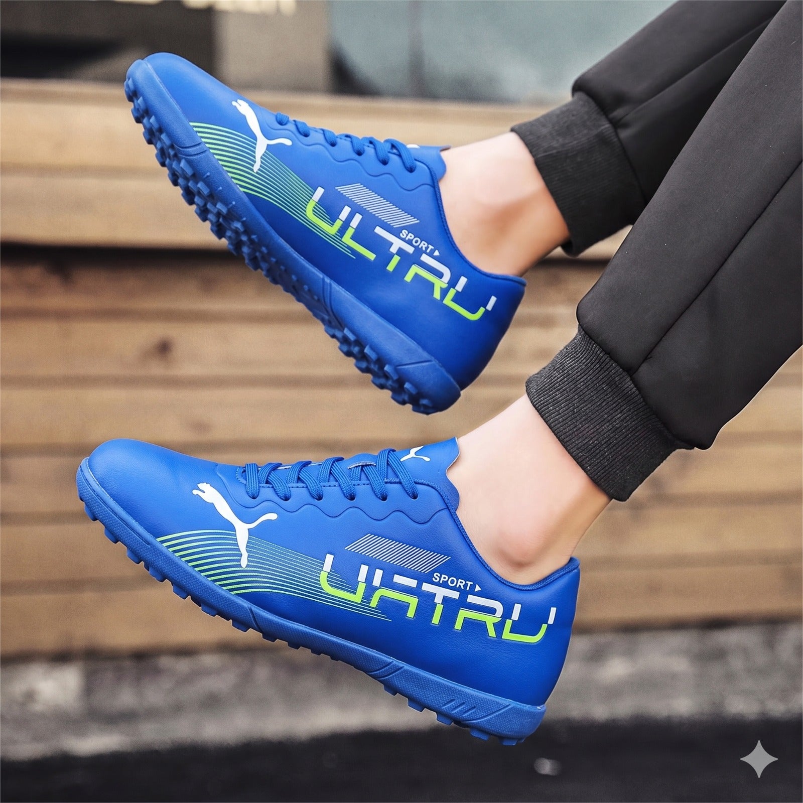 Blue sports shoes with 'Ultru' branding on a wooden floor