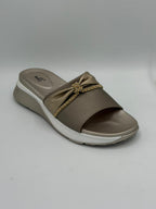 Brown sandal with a decorative bow on a gray background